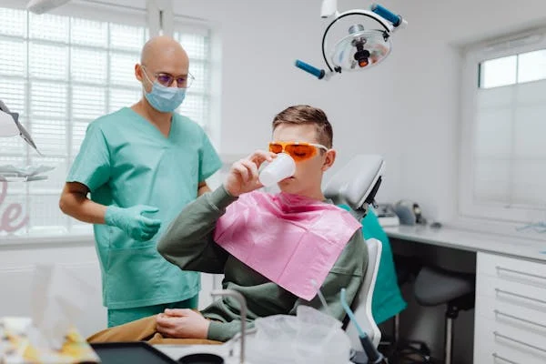 a man gargling after a dental treatment
