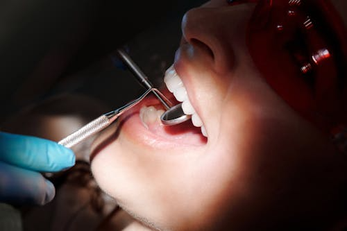 an image of a dentist performing dental procedure