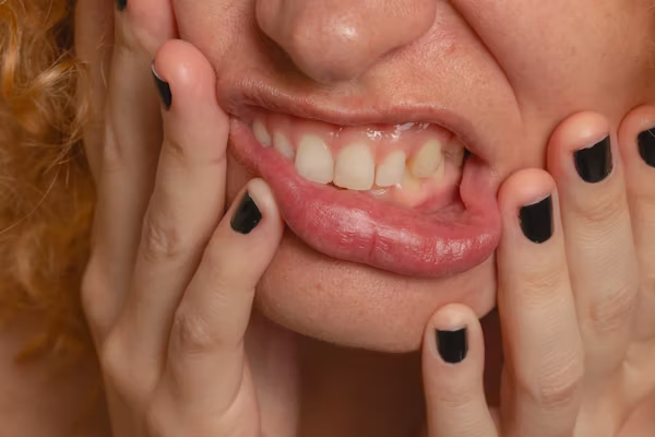 close-up shot of a woman's contorted mouth